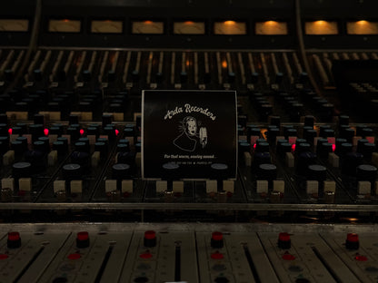 Black Arda Recorders logo sticker displayed on vintage analog recording console