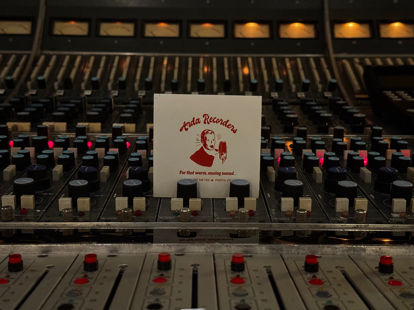 Red Arda Recorders logo sticker on white background displayed in recording studio