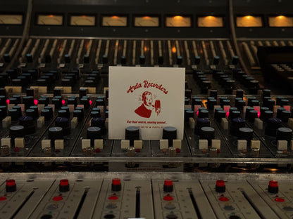 Red Arda Recorders logo sticker on white background displayed in recording studio