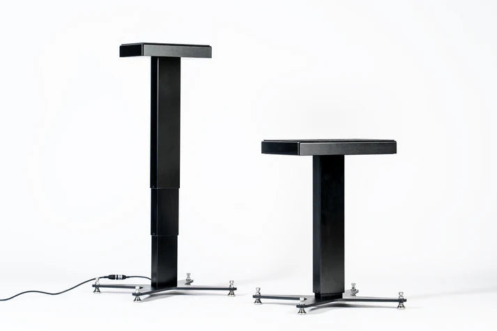 Two Space Lab Systems LIFT active studio monitor stands side-by-side demonstrating the minimum and maximum motorized height extension range