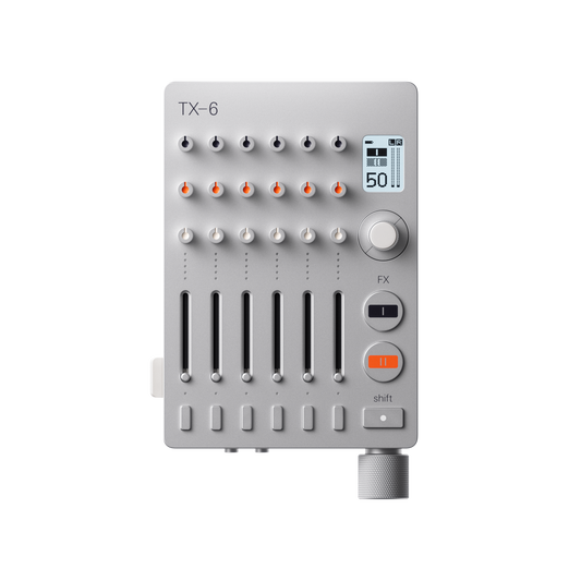Front view of the silver Teenage Engineering TX–6 portable stereo mixer showing its control knobs, vertical track faders, and digital display screen