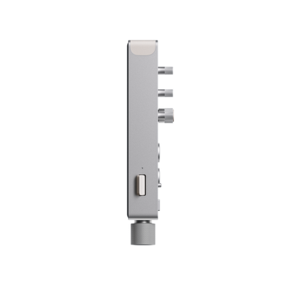 Side profile view of the slim anodized aluminum Teenage Engineering TX–6 mixer highlighting its compact depth and protruding metallic control knobs