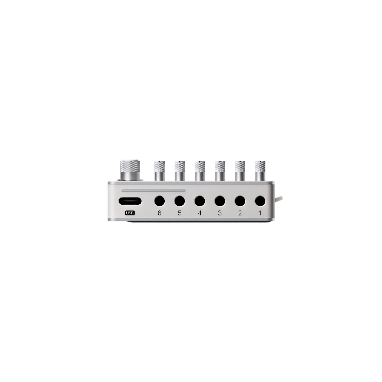 Top edge view of the Teenage Engineering TX–6 hardware showing the USB-C audio interface port alongside 3.5mm mini jack inputs numbered 1 through 6