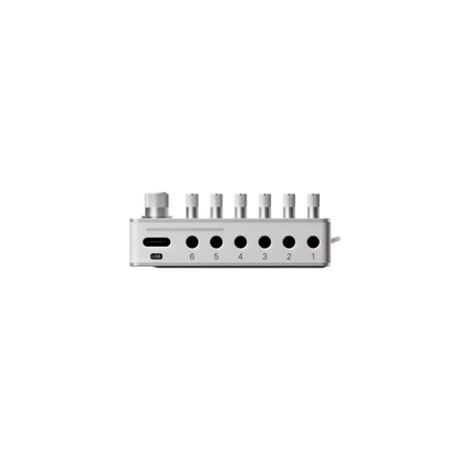Top edge view of the Teenage Engineering TX–6 hardware showing the USB-C audio interface port alongside 3.5mm mini jack inputs numbered 1 through 6